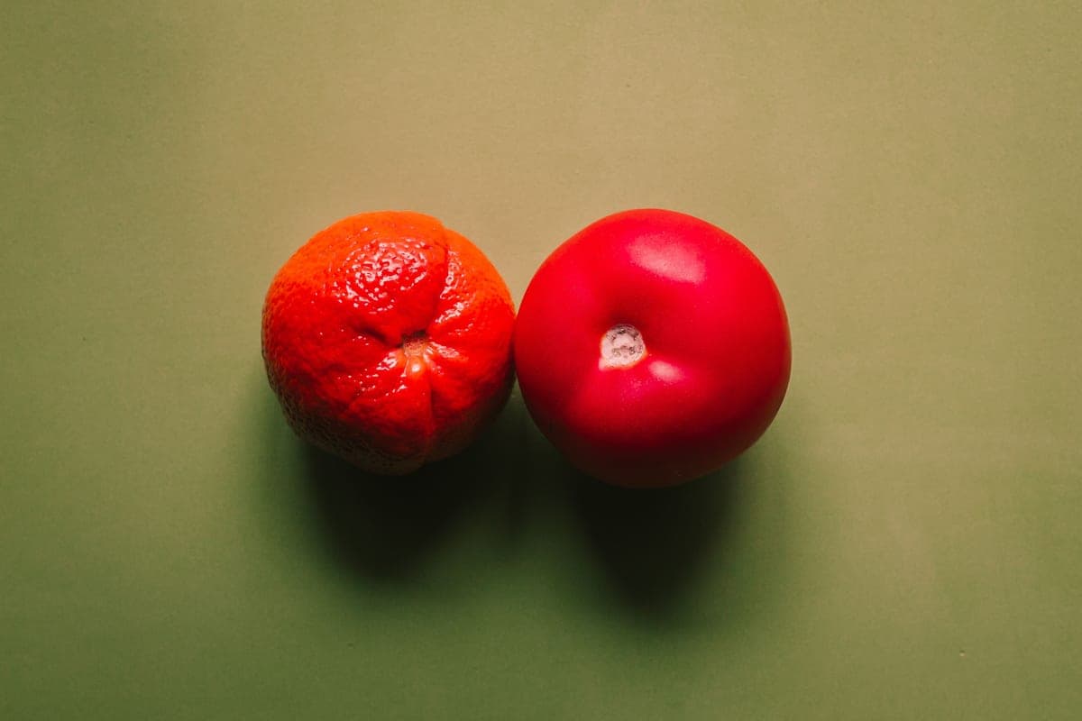 Two similar objects placed side by side on a desk for comparison