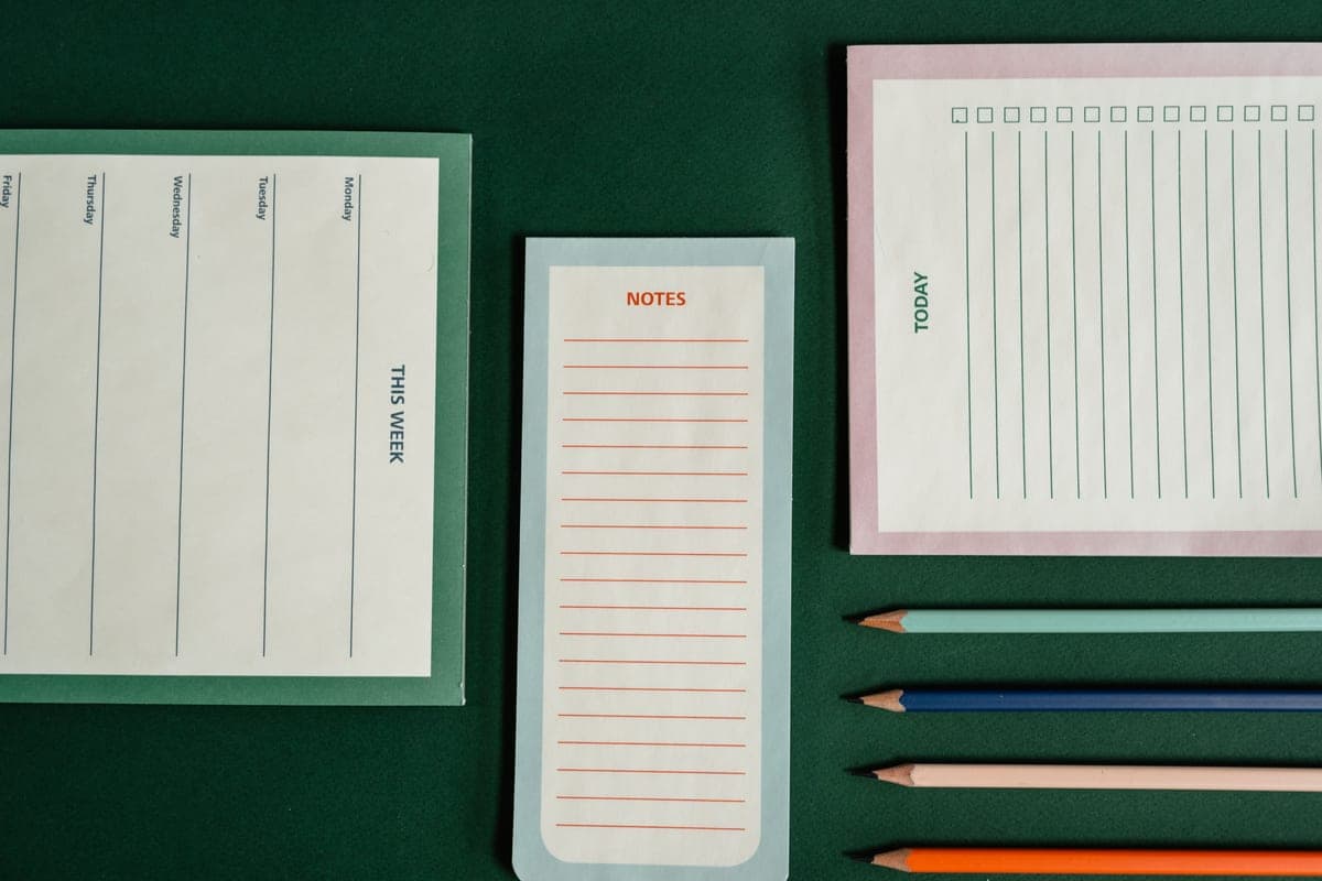 An open notebook and pencil on a desk, used for planning